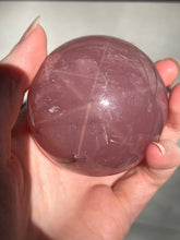 Load image into Gallery viewer, Lavender 6 Ray Star Rose Quartz sphere with Smoky Quartz inclusions and sphere stand