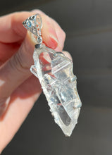 Load image into Gallery viewer, Luminous Arkansas Quartz with bridge formation and Blue Topaz pendant