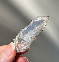 Load image into Gallery viewer, Luminous Arkansas Quartz with bridge formation and Blue Topaz pendant