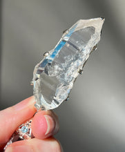 Load image into Gallery viewer, Luminous Arkansas Quartz with bridge formation and Blue Topaz pendant