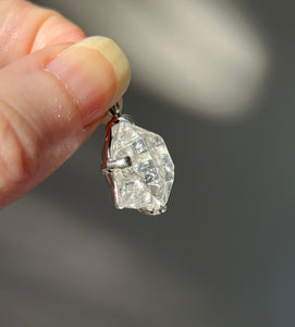 Luminous 11.8 carat Herkimer Diamond pendant with penetrating side car crystal