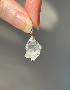 Luminous 11.8 carat Herkimer Diamond pendant with penetrating side car crystal