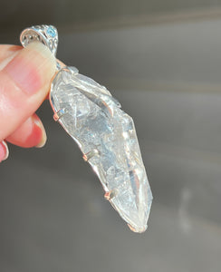 Luminous Arkansas Quartz with bridge formation and Blue Topaz pendant