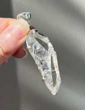 Load image into Gallery viewer, Luminous Arkansas Quartz with bridge formation and Blue Topaz pendant