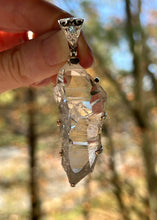 Load image into Gallery viewer, Luminous Arkansas Quartz with bridge formation and Blue Topaz pendant