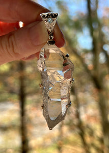 Luminous Arkansas Quartz with bridge formation and Blue Topaz pendant