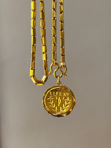 23k solid yellow gold 22 inch Thai baht chain necklace with pretzel clasp - stamped “965%”
