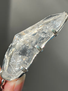 Luminous Arkansas Quartz with bridge formation and Blue Topaz pendant