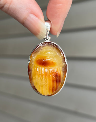 Natural (NOT heated) hand Carved Baltic Amber Scarab beetle pendant