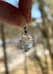 Luminous 11.8 carat Herkimer Diamond pendant with penetrating side car crystal