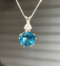 Load image into Gallery viewer, Tibetan Blue Obsidian Star of Venus necklace with trillion cut Danburite