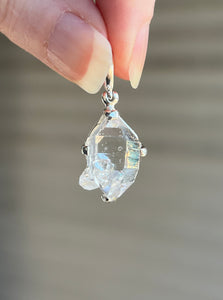 Luminous 11.8 carat Herkimer Diamond pendant with penetrating side car crystal