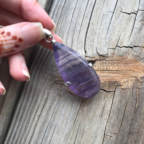 Faceted purple fluorite teardrop pendant